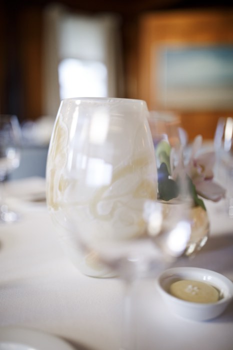 Hurricane glass and orchid, catching the last of the daylight.