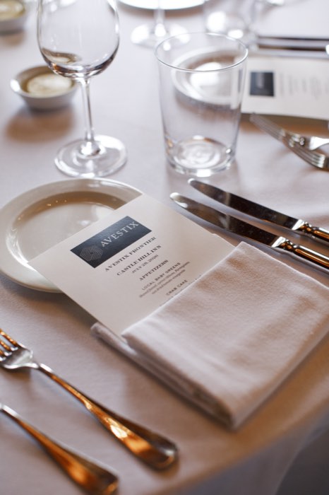 Glassware and menus down the length of the table.
