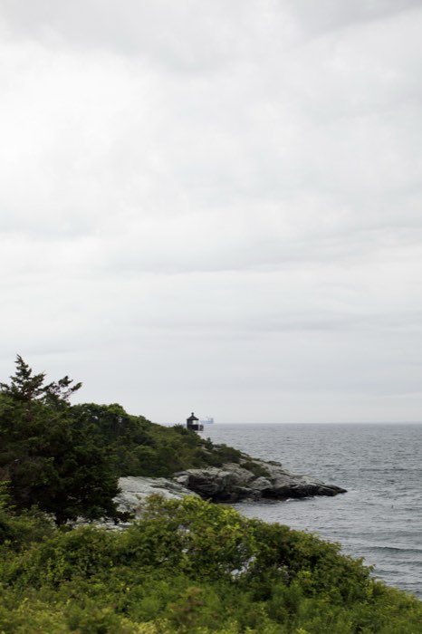 Rocks, sea and the open bay beyond.