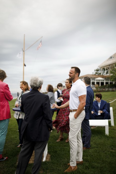 Guests gathered near the flagpole.