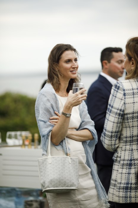 A guest with a drink during the reception.