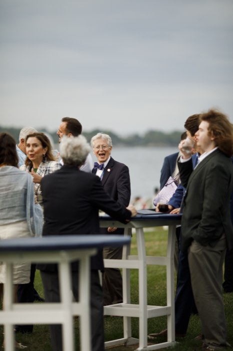 Guests with the bay behind them.