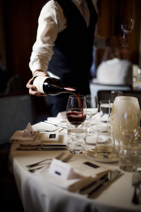 Wine poured as dinner began.