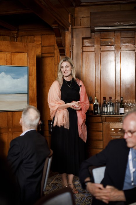 Susan Lindeque, speaking beside the dining room's seascape.